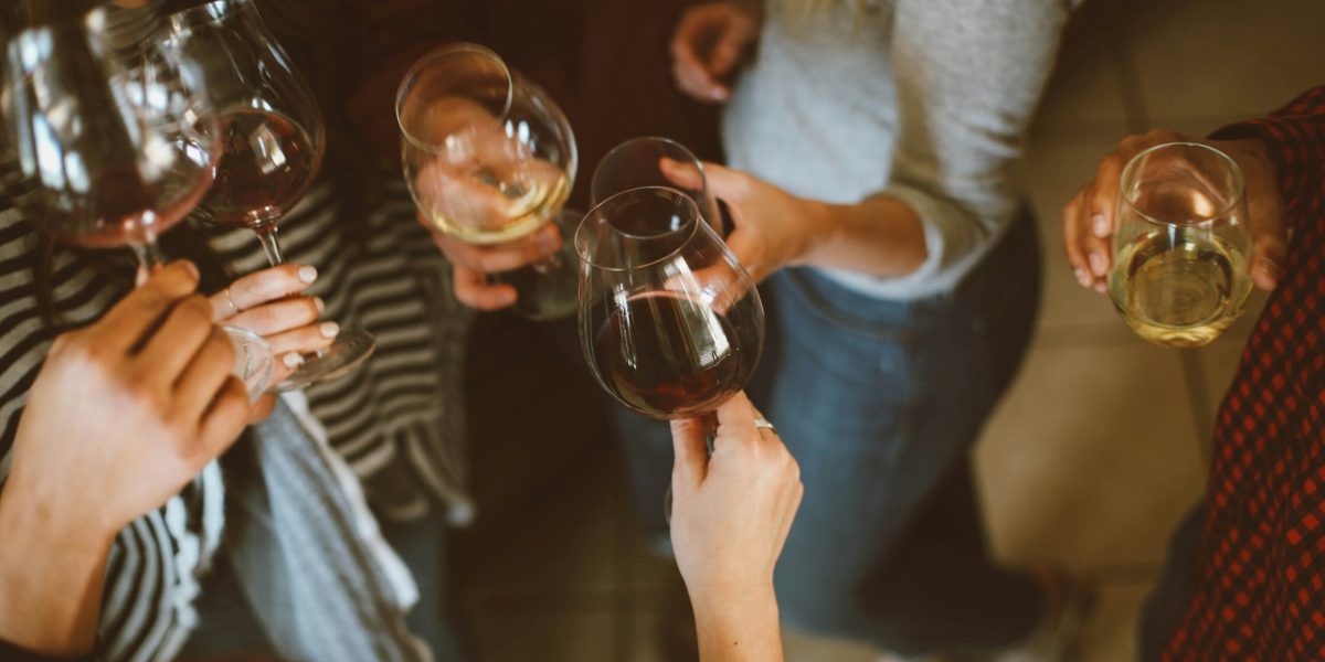 People Standing with Wine Cheers